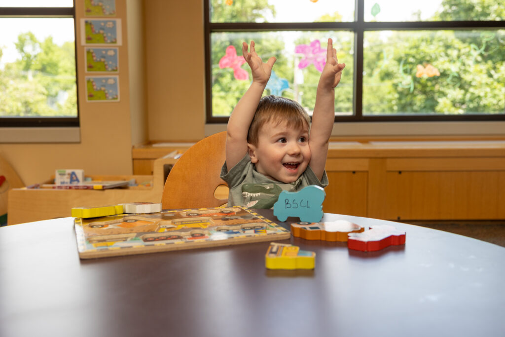 Child playing with toys in the children's area of the Library